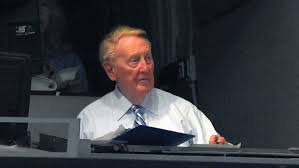 Vin Scully waiting for is cue to start the game. (